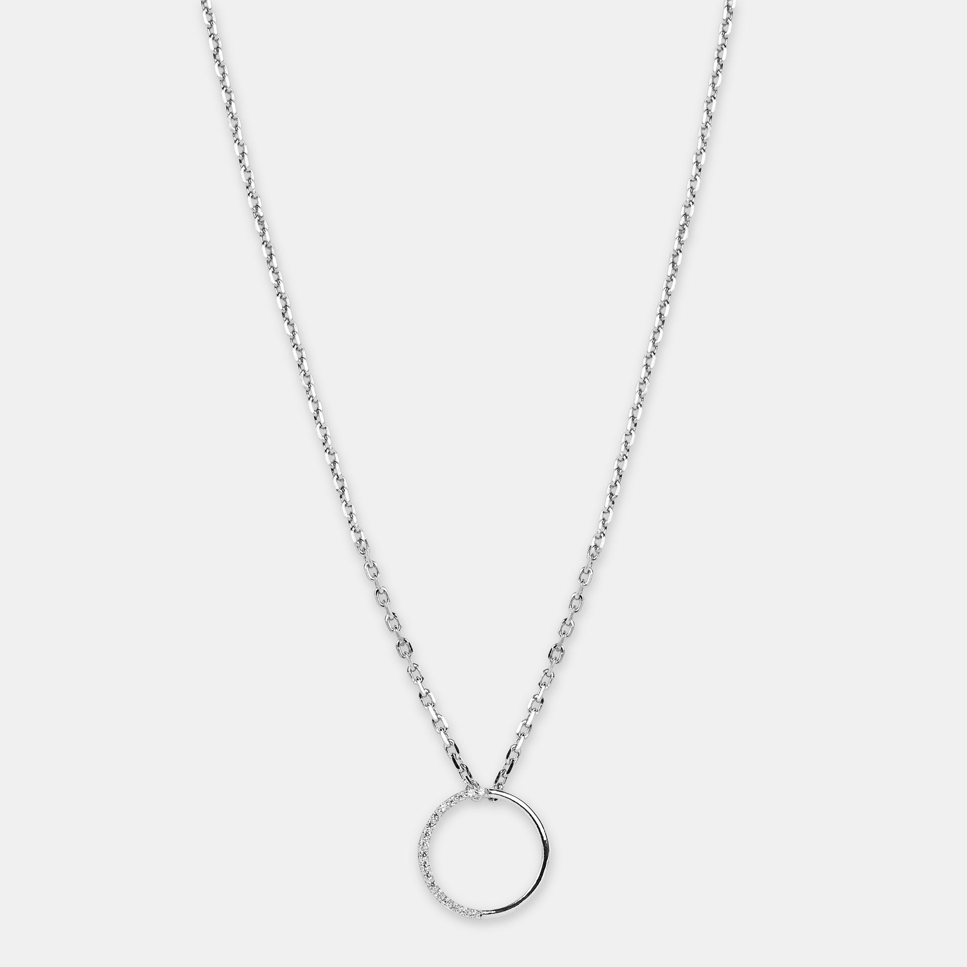 Silver necklace with a unique full moon pendant with american diamonds on a light gray background 
