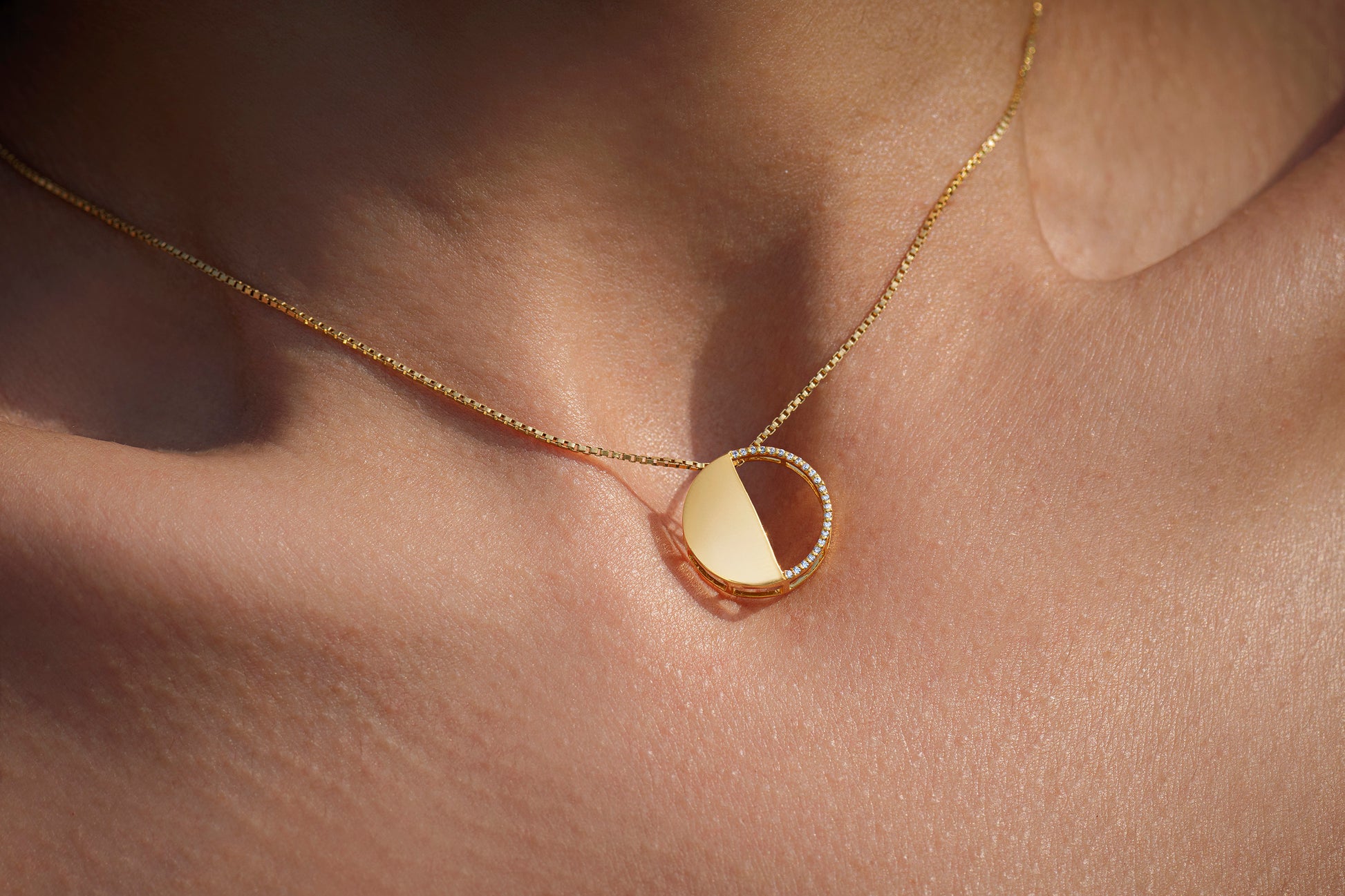 First Quarter Pendant in 92.5 Sterling Silver and high gold polish with chain, featuring american diamonds