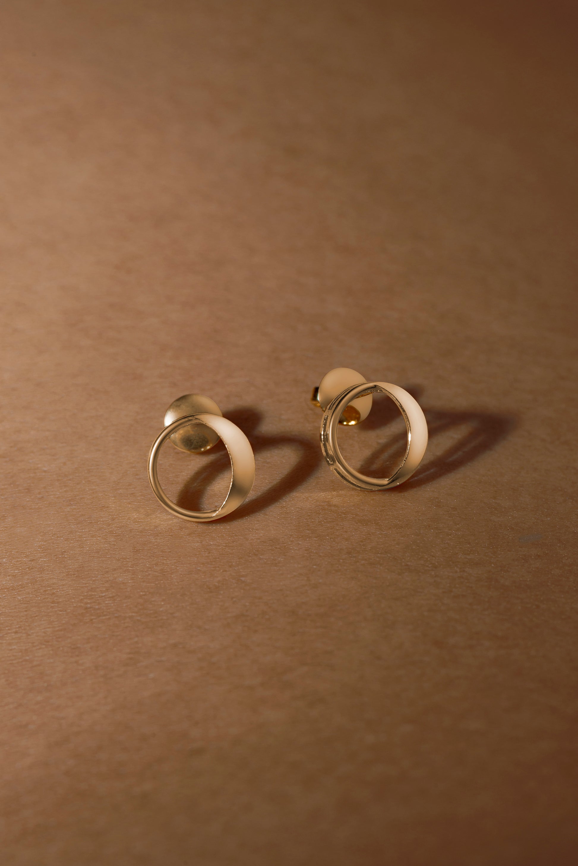 Waxing gibbous phase earring design, crafted from sterling silver with a high polish finish