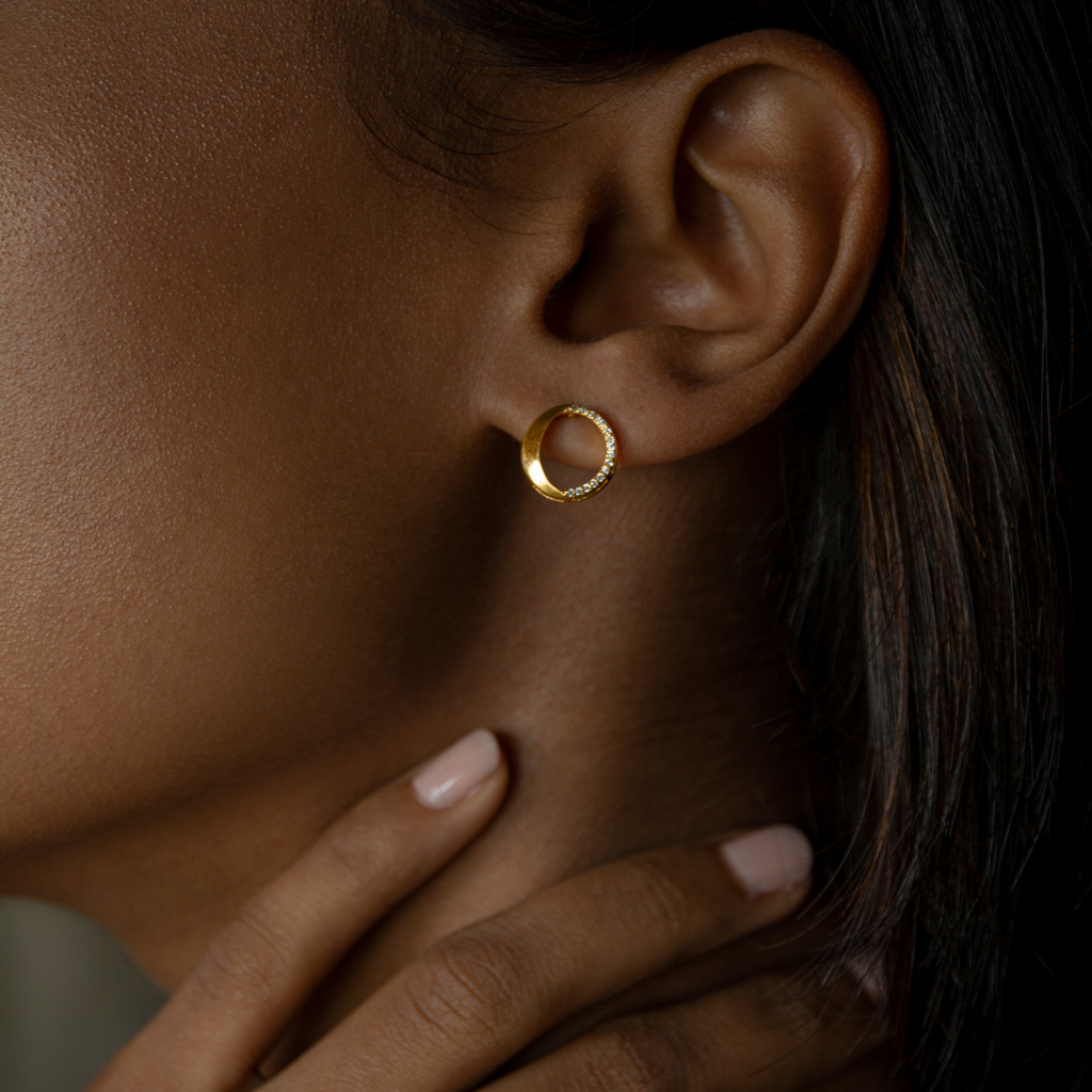 Waxing gibbous phase design, crafted from sterling silver with a high polish finish, featuring american diamonds