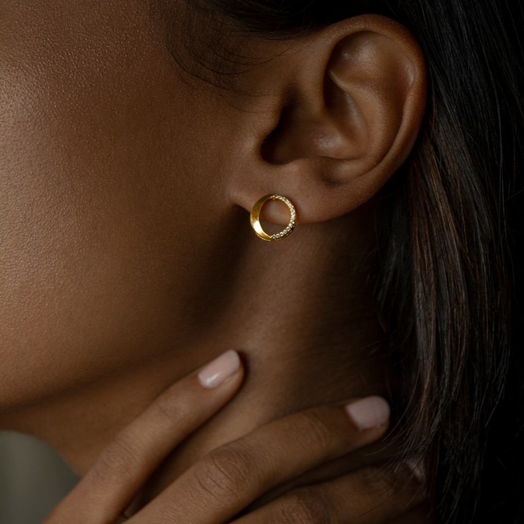 Waxing gibbous phase design, crafted from sterling silver with a high polish finish, featuring american diamonds